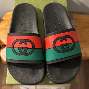 Gucci men slides. Large GG on top (used). Worn once…..
